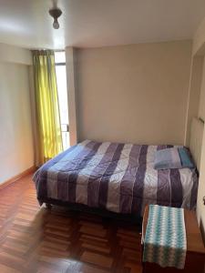 Ένα ή περισσότερα κρεβάτια σε δωμάτιο στο Departamento full amoblado centro de Cusco