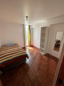 Ένα ή περισσότερα κρεβάτια σε δωμάτιο στο Departamento full amoblado centro de Cusco