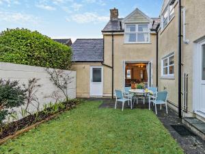 a house with a yard with a table and chairs at 3 bed in Fishguard 37270 in Fishguard