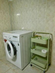a washing machine in a bathroom with a washer at Διαμέρισμα στην φύση in Kiriákion