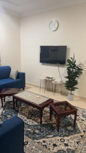 a living room with a couch and a coffee table at Apartment ready for daily rent Quiet, two bedrooms in Al Madinah