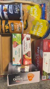 a pile of bags of food on a shelf at Apartment ready for daily rent Quiet, two bedrooms in Al Madinah +4 photos