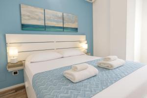 Postel nebo postele na pokoji v ubytování Iris Rooms