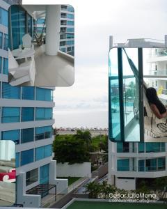 a person is sitting on a balcony of a building at Emmaus in Cartagena de Indias