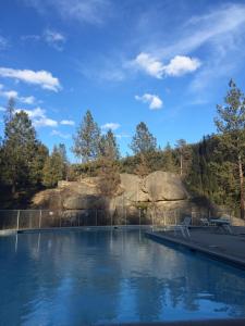 a pool of water with trees in the background at Lolo Hot Springs in Lolo Hot Springs