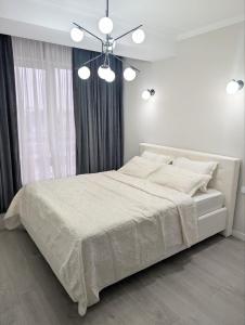 Ένα ή περισσότερα κρεβάτια σε δωμάτιο στο Business Luxury Apartment at Ismail Book 10 nights and get 1 free