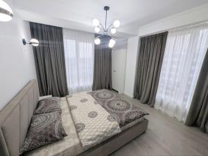 Ένα ή περισσότερα κρεβάτια σε δωμάτιο στο Business Luxury Apartment at Ismail Book 10 nights and get 1 free