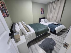 a small bedroom with two beds and a window at Room 3 Shared house 5 min from Sefton Park in Liverpool