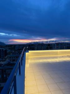 a view of the rooftop of a building at night at Chic Apartament Free Parking in Vlorë