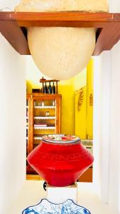 a room with a table with a red table at Terraza del Mar in Arrieta