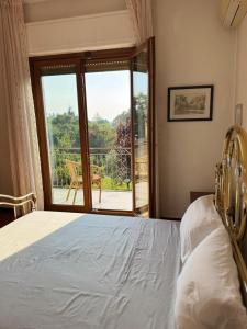 Ένα ή περισσότερα κρεβάτια σε δωμάτιο στο Villa Mirella Como