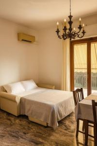 Ένα ή περισσότερα κρεβάτια σε δωμάτιο στο Villa Mirella Como