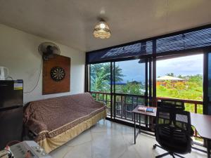 Ένα ή περισσότερα κρεβάτια σε δωμάτιο στο Cruisers Villa Ysay 2