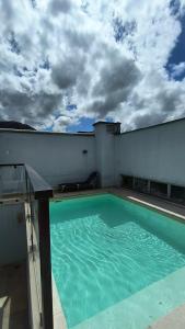 a swimming pool on the roof of a building at Saint Sebastian 106 in Jaraguá do Sul