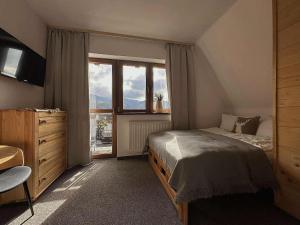 Postel nebo postele na pokoji v ubytování Dom na Wierchu