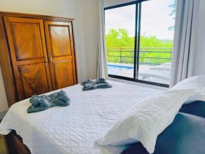 Postel nebo postele na pokoji v ubytování Casa Colibri Tropical Ocean View 5 min to Beach + 39 fotografií