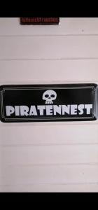 a black and white sticker on the front of a car at Piratennest in Osteel