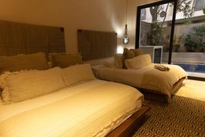 Ένα ή περισσότερα κρεβάτια σε δωμάτιο στο Chen Luum Residences - Departamentos de lujo en Luum Zama