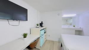 TV a/nebo společenská místnost v ubytování Boutique on the Beach