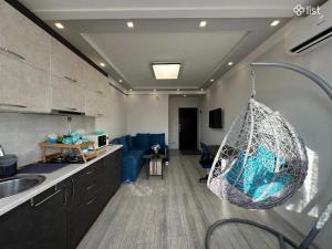 a kitchen with a hammock hanging from the ceiling at Apartment Zaqyan street in Yerevan