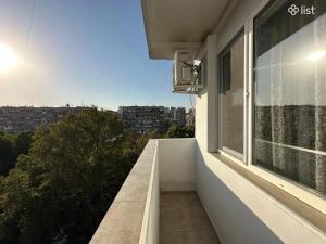 a balcony with a view of a city at Apartment Zaqyan street in Yerevan