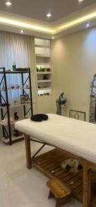 a room with a table and a shelf at Erniesa in Accra