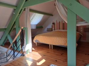 Postel nebo postele na pokoji v ubytování Aux 4 Saisons