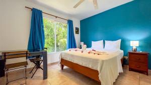 Giường trong phòng chung tại Renaissance Residence Cabarete +21 ảnh