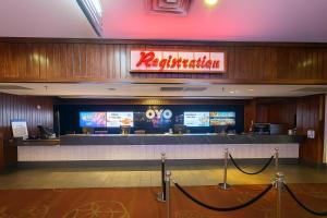 a restaurant with a bar in the middle of a building at OYO Hotel and Casino Las Vegas in Las Vegas +91 photos