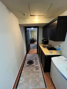 a small kitchen with a sink and a counter top at APARTMENT PORTO El SOKHNA EGYPT-FAMILY in Ain Sokhna