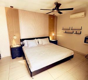 a bedroom with a bed with a ceiling fan at Habitacion Olmo in Saltillo
