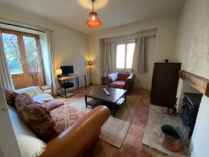 a living room with a couch and a fireplace at CASA VACANZA Dimora del tempo in Fara San Martino