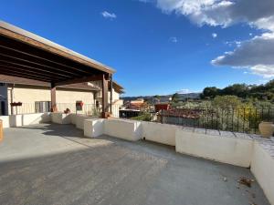 a building with a fence next to a road at CASA VACANZA Dimora del tempo in Fara San Martino