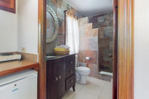 a bathroom with a toilet and a sink and a shower at Yellowtail Cabana at Latitude Adjustment -Gold Standard Certified in Hopkins +11 photos