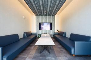 Posezení v ubytování The Pool House Tokyo Bay