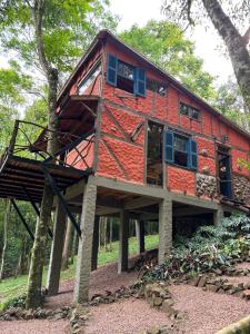 a tree house in the middle of a forest at Casa Ar Fresco in Sapiranga +22 photos