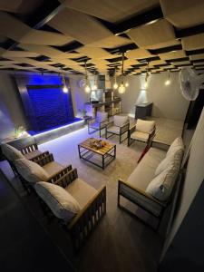a large living room with couches and a table at عمان البحر الميت in Sowayma