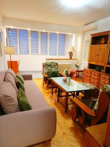 a living room with a couch and a table at Home Sweet Home No1 in Belgrade