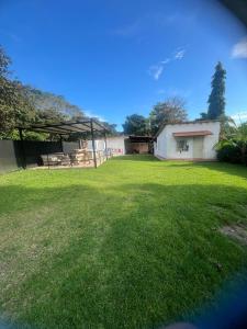 a large yard with a pavilion and a building at Las Guias Cabaña Privada in Río Hato +7 photos