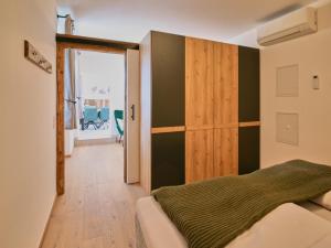 a bedroom with a bed and a sliding door at ALP'N SOUL - AlpenLuxus Collection in Voldöpp +20 photos