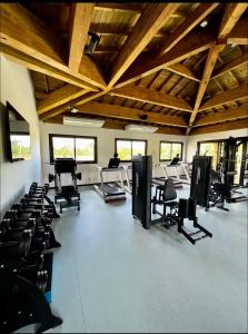 a large room with chairs and desks in it at Studio lindíssimo Vila do Lago- 900m da vila in Praia do Forte +4 photos