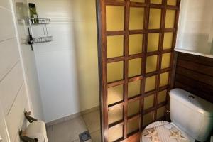 a small bathroom with a toilet in a room at Chalet Sleeps 2 - Pool Balcony Mountain Views in Estepona