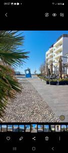a view of a sidewalk with buildings in the background at Casa con giardino in Cecina