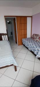 Postel nebo postele na pokoji v ubytování Apartamento Temporada Jacaraípe - ES + 15 fotografií