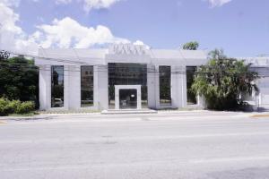 a white building with a sign on top of it at Downtown Suites - Hotel Boutique by Maraf in Cancún