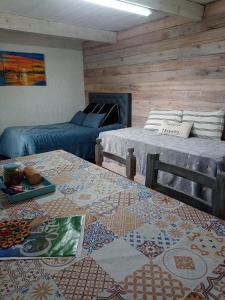 a living room with a couch and a table at Monoambiente Loft La Tranquilidad in Mar del Tuyú