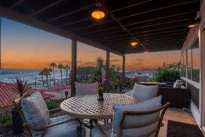 a patio with a table and chairs and a view of the ocean at Best Value in SD $1M Views; Great Location; WD in San Diego