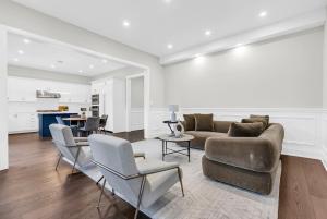 a living room with a couch and chairs and a table at Welcome to Your Comfort Retreat by the Lake in Burlington