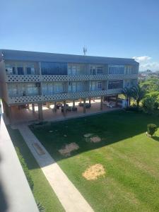 a large building with a park in front of it at Beachfront apartment, exclusive view! in Xangri-lá +10 photos