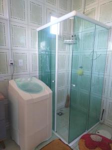 a bathroom with a shower and a toilet at Beachfront apartment, exclusive view! in Xangri-lá
